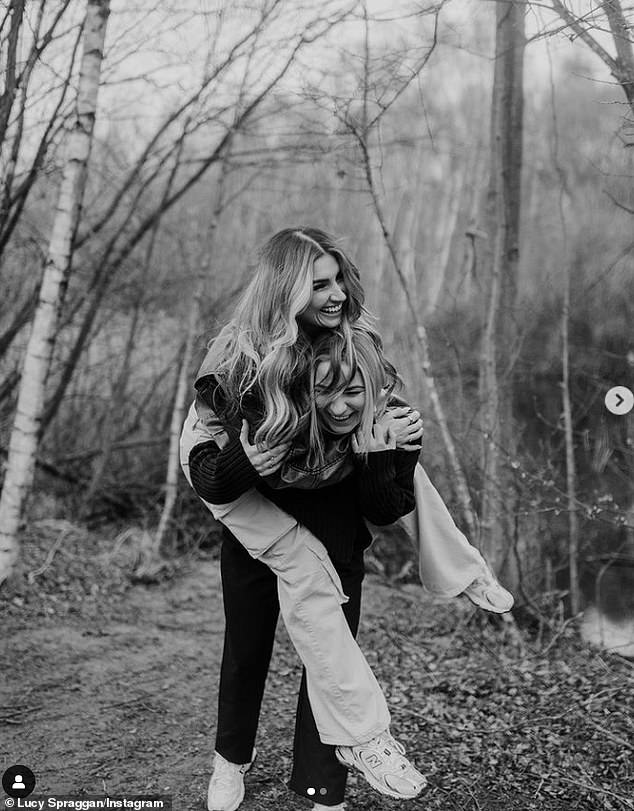 Looking loved up in the sweet snaps, Lucy smiled with Emilia balanced on her back before they also shared a kiss.