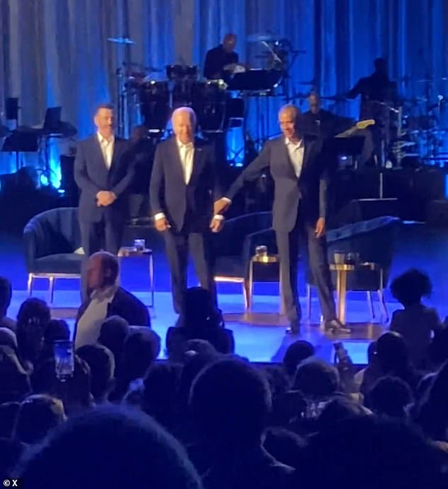 Former President Barack Obama was seen giving Biden's arm a gentle tug and leading him off the stage after the president froze during applause at a fundraising event in Los Angeles.