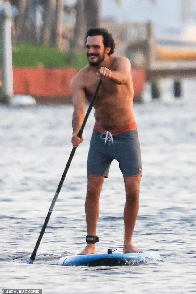 Joaquim showed off his toned physique while going shirtless and sporting a swimsuit for the athletic endeavor.