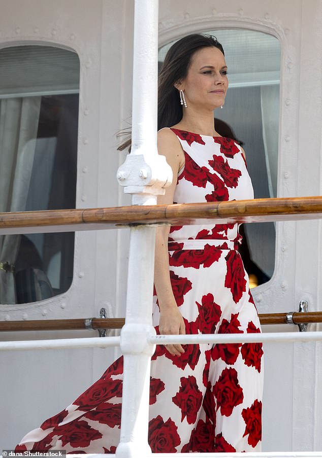 The Swedish princess paired her vibrant dress with statement pearl earrings.