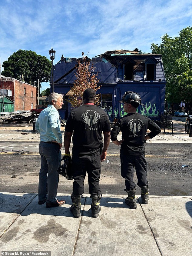 The Old Pink is considered an iconic Buffalo landmark that its owner, Molly Brinkworth, has been running for more than three decades. (Pictured: New York State Senator Sean Ryan at the scene after the fire)