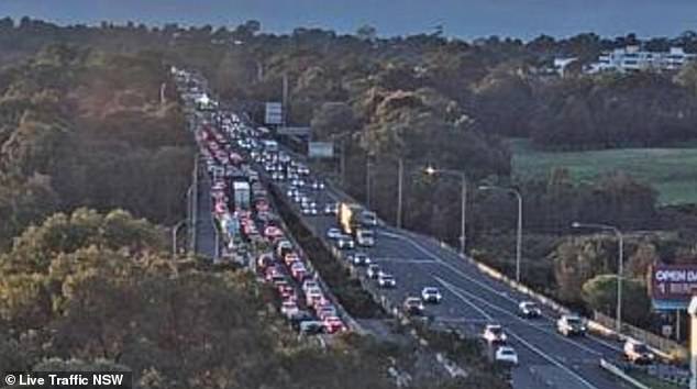 The vehicle overturned after colliding with another car in the M5 tunnel near Bardwell Valley, in Sydney's south, at 6.40am on Tuesday.