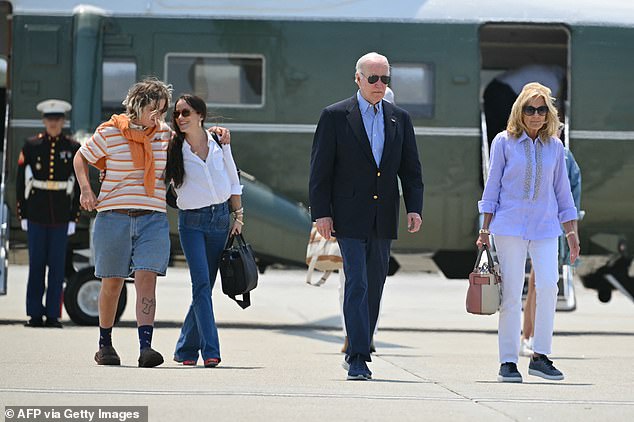 President Joe Biden (center right) and first lady Jill Biden (right) walk to Air Force One followed by their granddaughter Maizy (left) and first daughter Ashley Biden (center left) as they depart Los Angeles on Sunday.