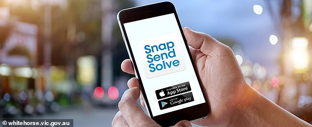 The Snap Send and Save app allows residents to take photos of irregularities they have seen in their neighborhood and send these images to local councils to solve the problem (stock image)