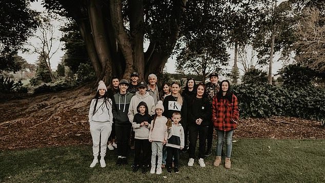 Julie Theobald, 47, was admitted to an intensive care unit in Melbourne on June 10 after a nasty bout of flu worsened and she contracted pneumonia (Theobald family pictured).