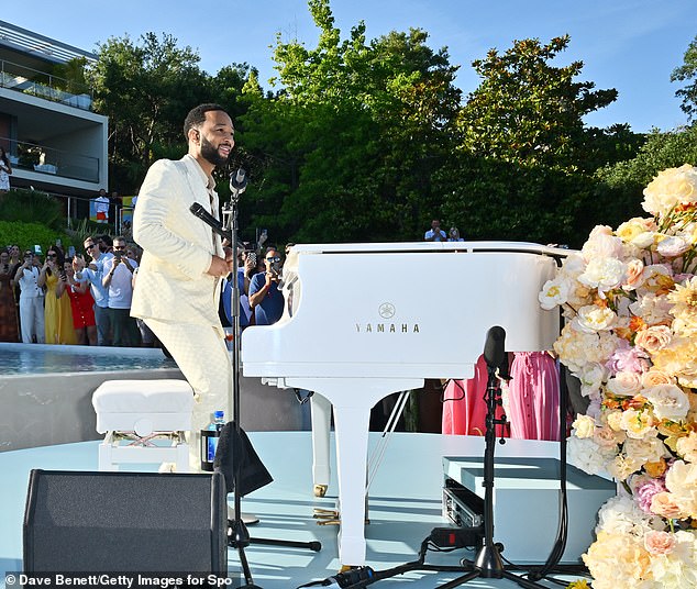 Legend performed at the garden-hosted event, playing a white Yamaha piano at one point