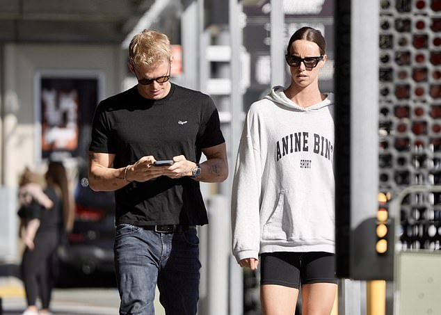 Cody, 27, wore a pair of jeans and a black T-shirt, while Emma, ​​30, wore an off-white Annie Bing hoodie and black biker shorts.