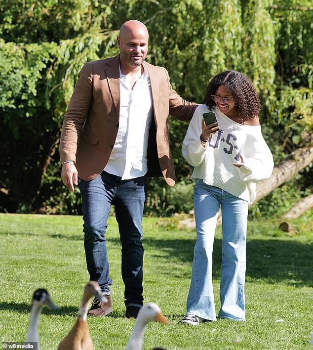 The father-daughter duo couldn't wipe the smile off their faces as they played with dogs, ducks and goats in the backyard.