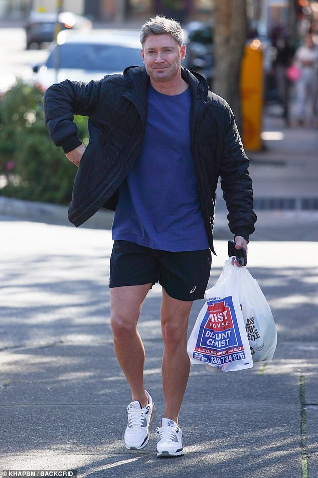 Clarke kept it casual in a blue T-shirt and a pair of black sports shorts.