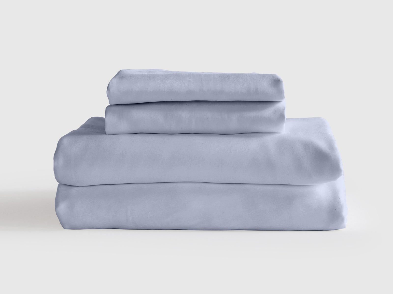 Pile of blue bamboo sheets and pillowcases.