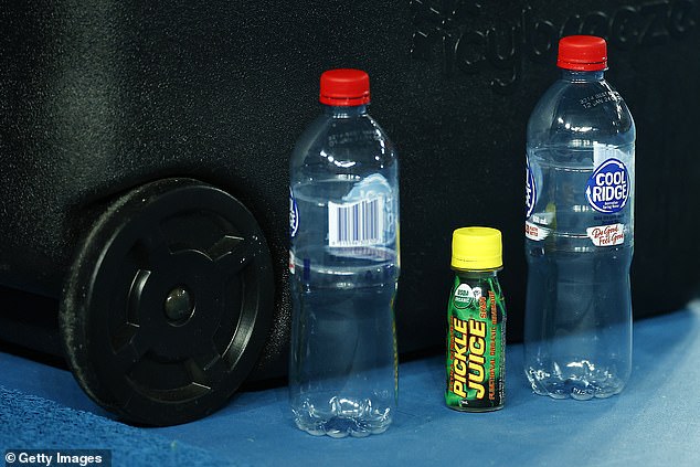 Trippier was drinking pickle juice, which helps athletes prevent cramps. Above, tennis player Daniil Medvedev places a bottle of the drink on his table during the 2022 Australian Open.