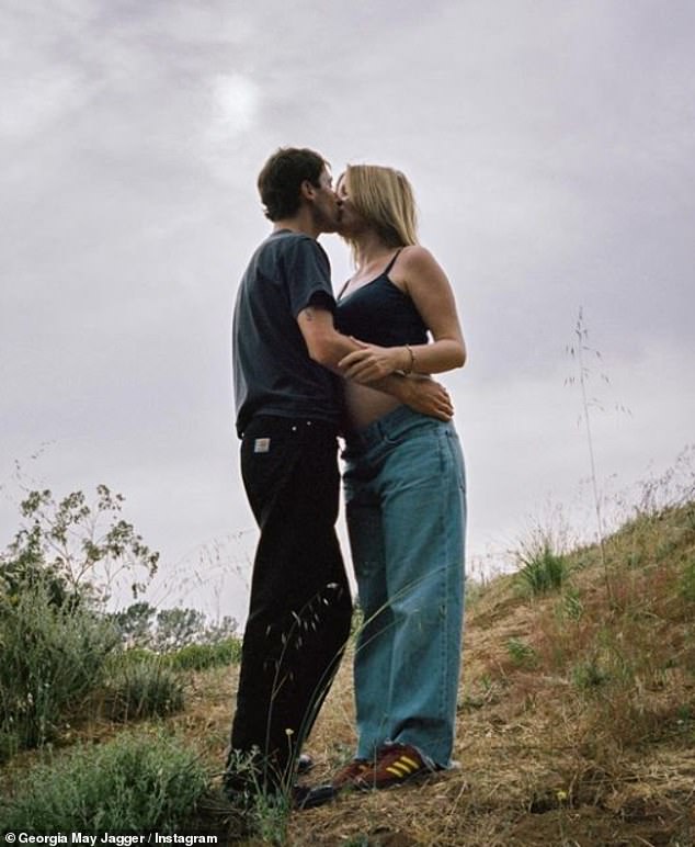 In another snapshot, the future parents shared a passionate kiss in a field, while Cambryan hugged her baby bump.