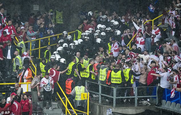 Police quickly arrived to quell the disorder, and officers dressed in protective clothing divided both groups of fans.