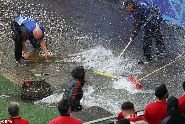 Gardening staff were seen using brushes to sweep excess rainwater into the soil.