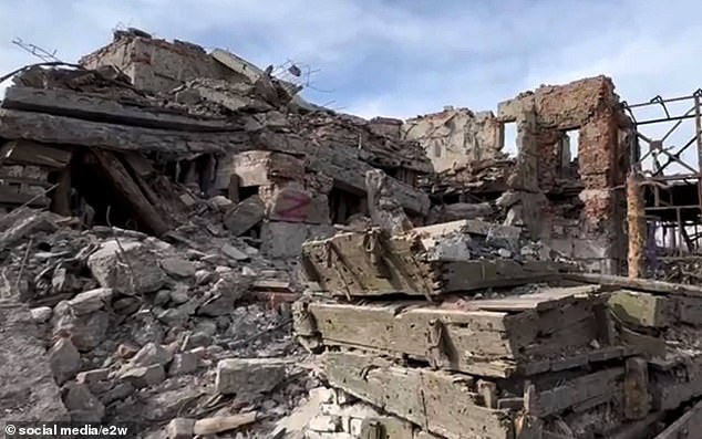 Rubble and Z graffiti are seen in a destroyed Ukrainian village in Donetsk, Ukraine.