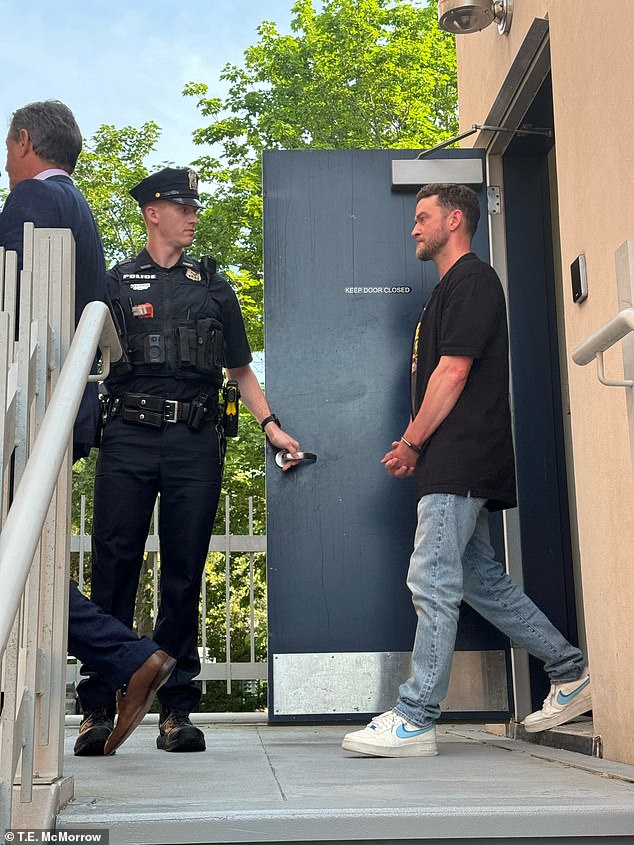 A teary-eyed Justin Timberlake was seen leaving the Hamptons police station, where he spent Monday night for drunk driving, in exclusive footage obtained by DailyMail.com.