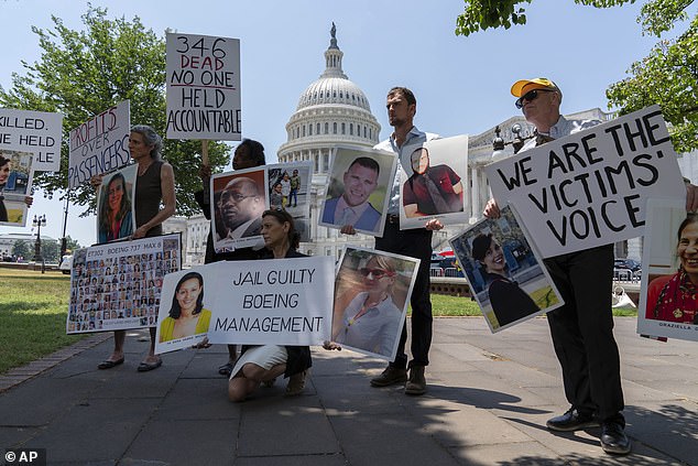 Relatives of victims of the Boeing 737 MAX8 crash in Ethiopia hold photographs during a news conference at the Capitol on Tuesday.