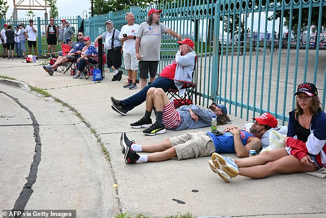 Rally-goers lined up hours before entry to the event opened, and some took naps as they waited for their chance to be one of the first inside Racine Festival Park.