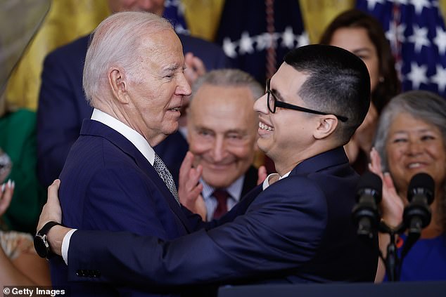 President Joe Biden (left) hugs Javier Quiroz Castro (right) at the White House on Tuesday. As the president commemorated the 15th anniversary of DACA, which gave Castro citizenship, he launched a plan to help the spouses of U.S. citizens who entered the United States illegally become citizens.