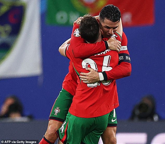 Ronaldo hugged Francisco Conceicao after the match following his 92nd minute winning goal.