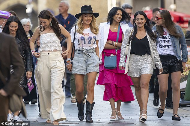 The Welsh singer, 43, smiled as she arrived with her friends wearing an outfit inspired by Taylor's fifth studio album, 1989.