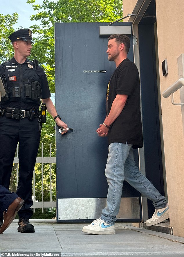 A teary-eyed Timberlake was seen leaving the Hamptons police station in handcuffs.