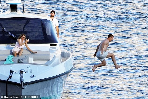 The former Chelsea and England captain relaxed with his wife aboard a chartered yacht during his current break in the sun on the island of Capri in southwestern Italy.