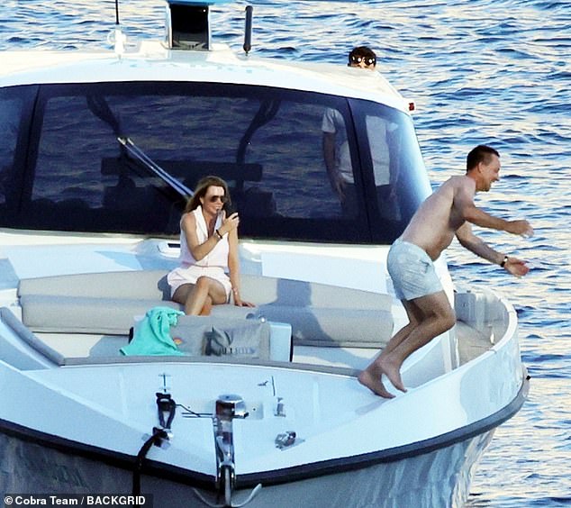 Toni photographed her husband doing a somersault from the deck of their boat