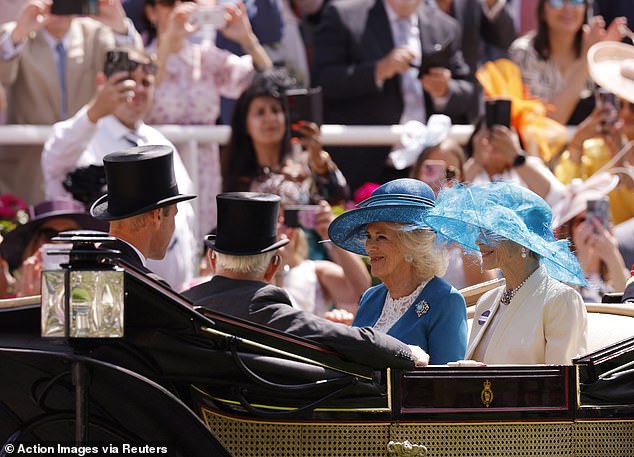 Prince William is seen sitting in front of a beaming Queen Camilla and the Countess of Halifax.