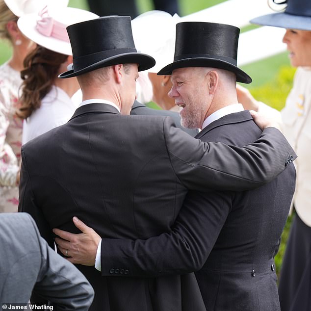 Prince William hugs Mike Tindall, his cousin Zara's husband, at Royal Ascot today