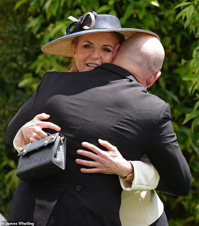 Zara's husband Mike Tindall was photographed giving Sarah Ferguson a warm hug during the reception.