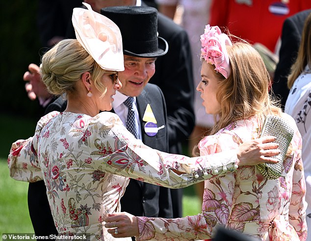 Pictured: Zara Tindall is seen hugging Princess Beatrice and Michael Middleton at Ascot.