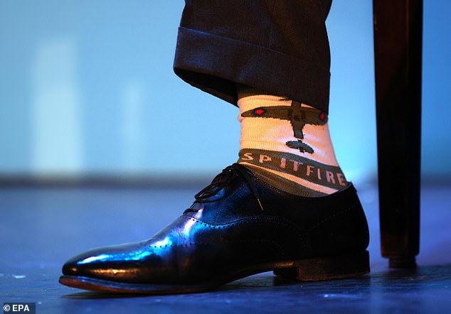 The smartly dressed Farage's footwear included these patriotic-looking socks.