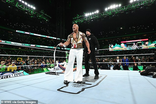 The Undertaker (center right) made a cameo at this year's Wrestlemania, where he eliminated The Rock (center left) on the second night to help Cody Rhodes defeat Roman Reigns.