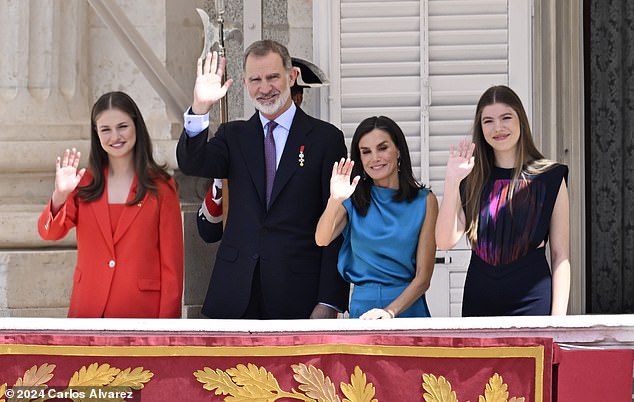 After a ceremony inside the Palace, the family of four appeared on the balcony to greet a crowd of royal fans (pictured).