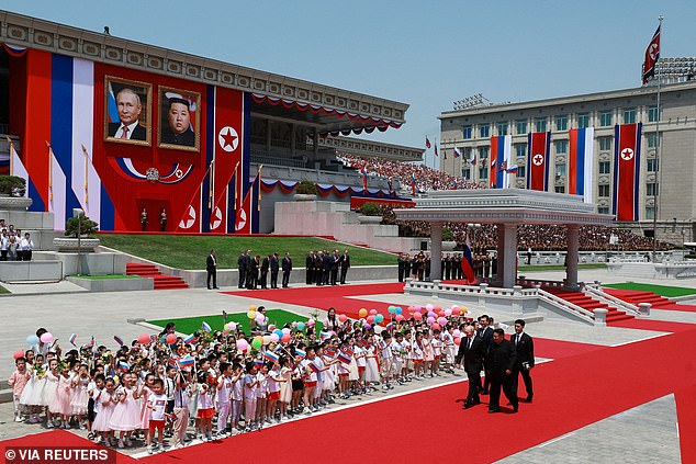 Russian President Vladimir Putin and North Korean leader Kim Jong Un attend an official welcoming ceremony at Kim Il Sung Square in Pyongyang.