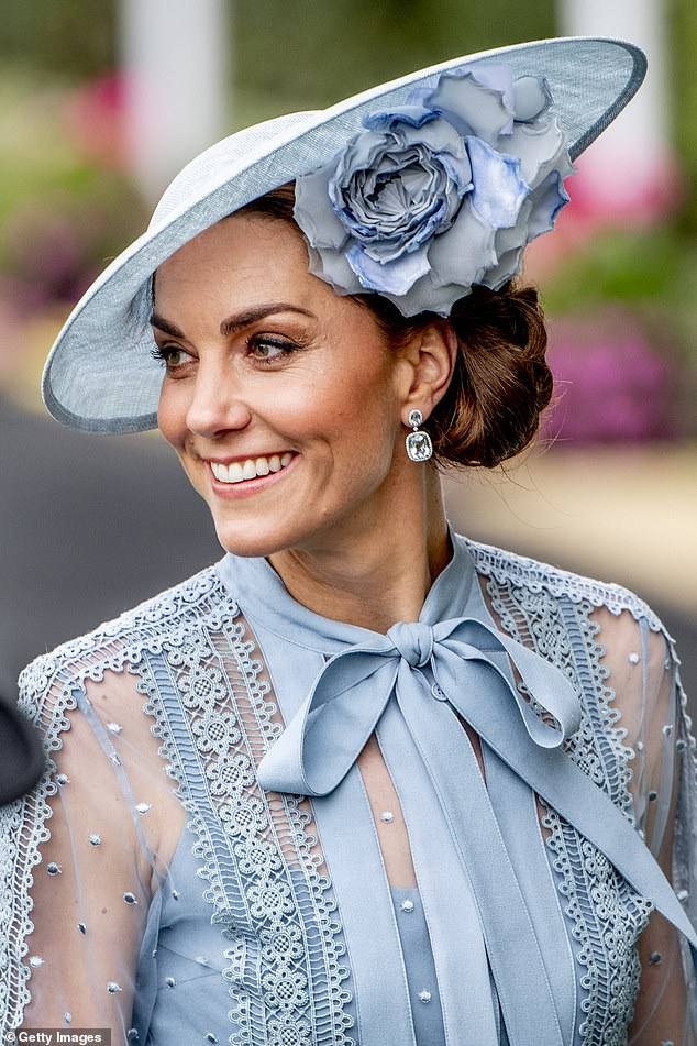 The Princess of Wales completed her elegant outfit with a striking floral hat from the London brand Philip Treacy.