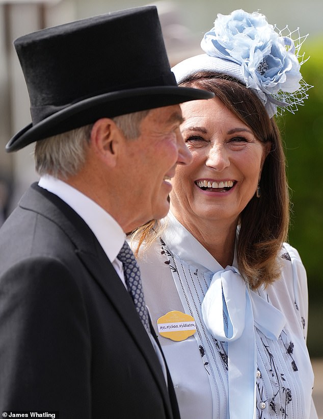 Carole echoed her eldest daughter's 2019 Philip Treacy hat with a similar blue floral headpiece.