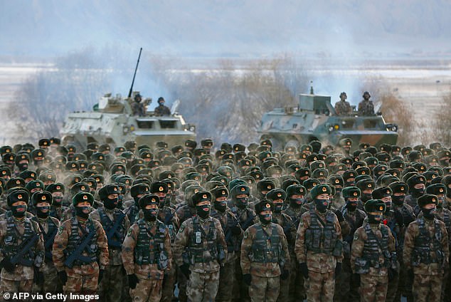 This photo taken on January 4, 2021 shows Chinese People's Liberation Army soldiers gathered during military training in the Pamir Mountains in Kashgar.