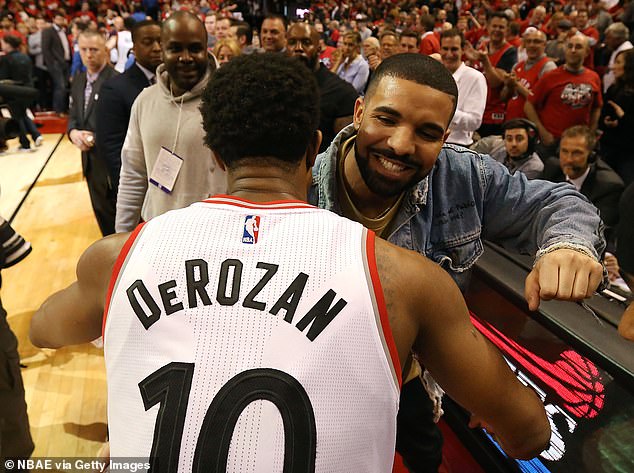 Drake and DeRozan hug after the Raptors beat the Pacers in Game 7 of the 2016 first round