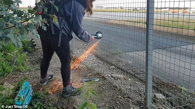 Video taken from the scene shows the two activists brazenly cutting a wire fence on the perimeter of the airfield.