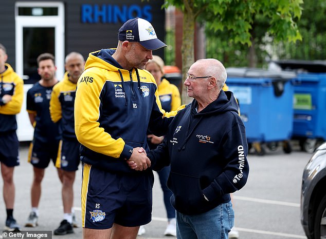 Smith welcomed Burrow's father Geoff (right) and mother Irene earlier this month as the club paid its respects.