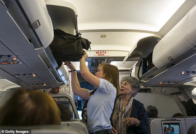 Travelers may be asked to check their carry-on bags for free while others board the limited space in a plane's compartments.