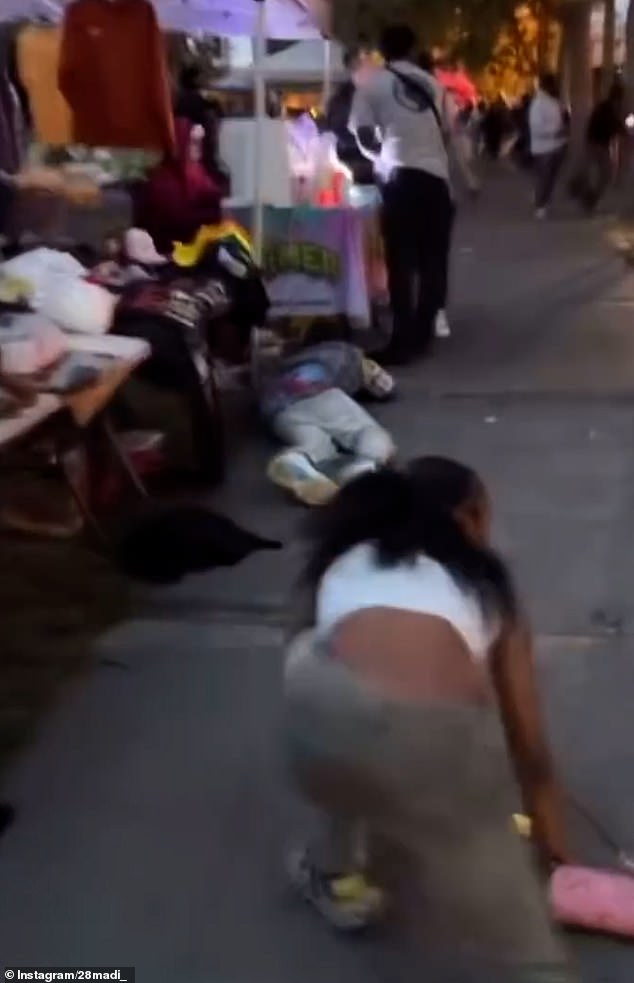 In another video, a woman was forced to kneel near the ground as she tried to get to safety.