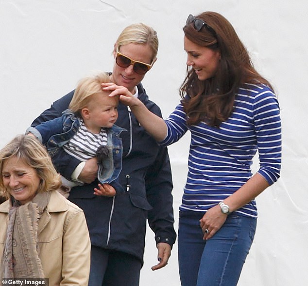 Kate, Zara and their daughter Mia share a warm moment in 2015, while attending the Gigaset Charity Polo Match at the Beaufort Polo Club.