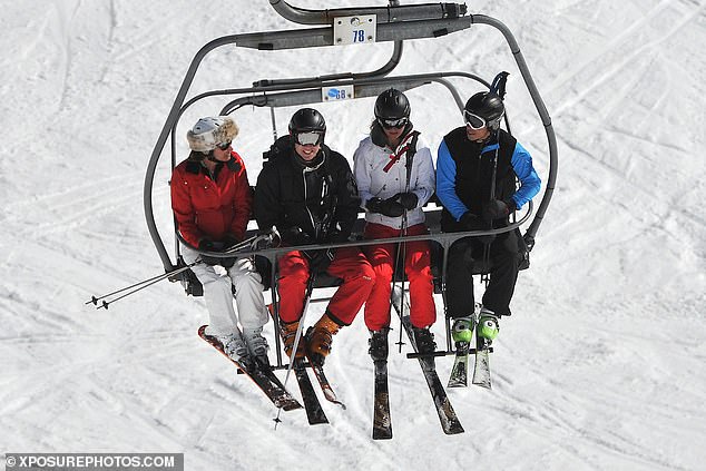 William with Kate, his brother James and mother Carole on a chairlift during a skiing holiday in 2012.