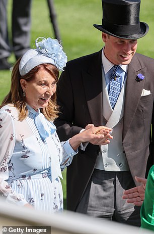 Carole takes William's hand.