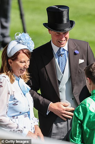 Carole Middleton speaks with Prince William, Prince of Wales, as they attend the second day of Royal Ascot