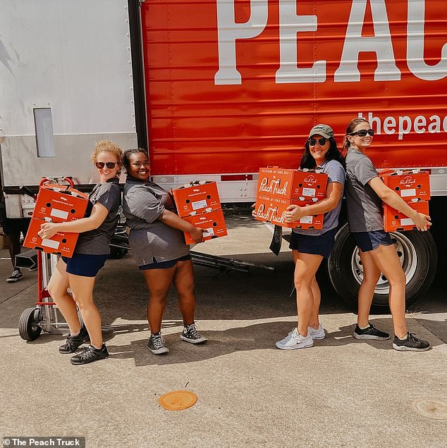 Employees are photographed in front of a company truck during the 2022 peach season.