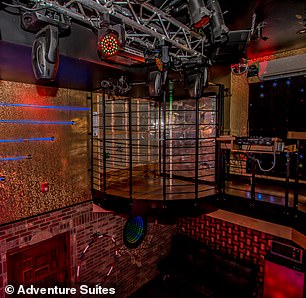 The 800-square-foot suite offers plenty of space for guests to dance, including a cage with a stripper pole.